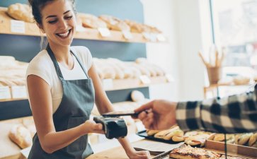 small business owner using a credit card processing app