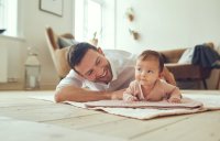Father at home with baby