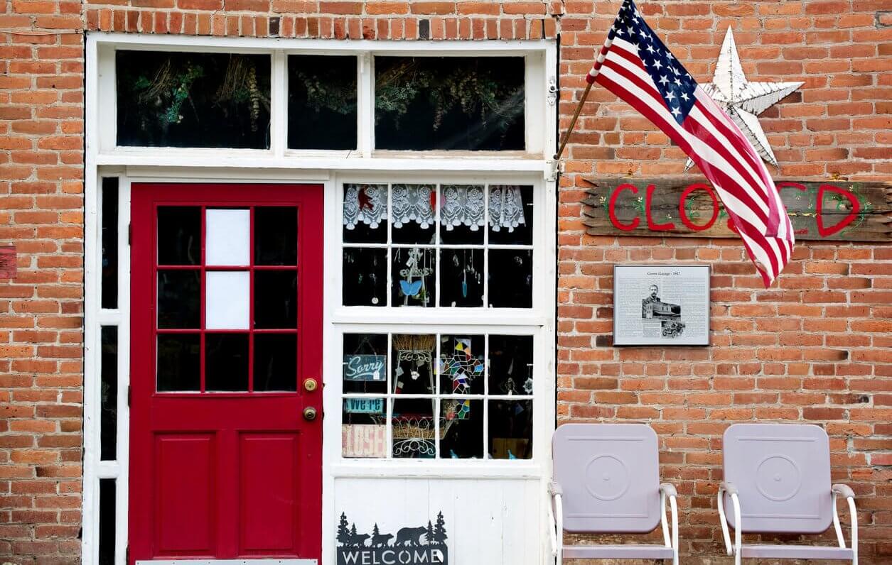 American flag displayed on small business storefront