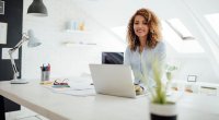 Female small business owner working at the computer