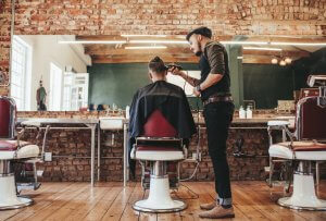 male barber cutting a man's hair