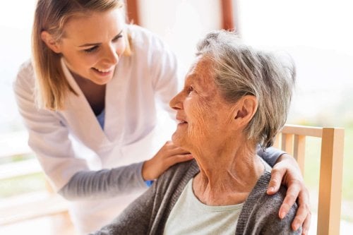 home-care nurse helping old woman