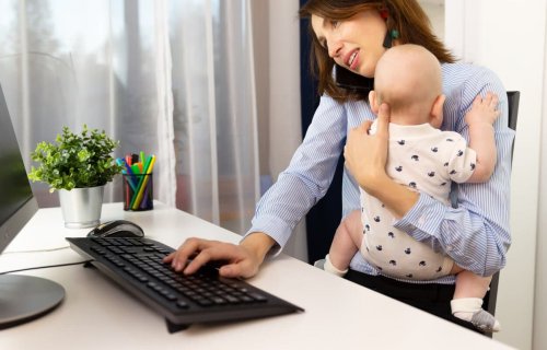 Working woman holding baby