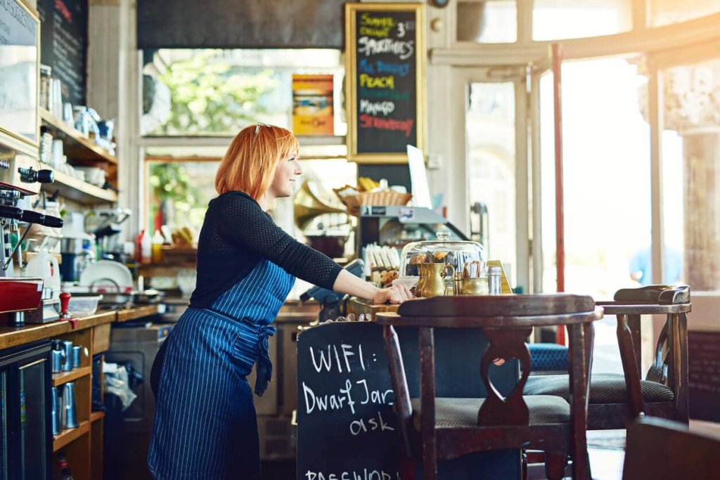 Woman leaning on cafe counter