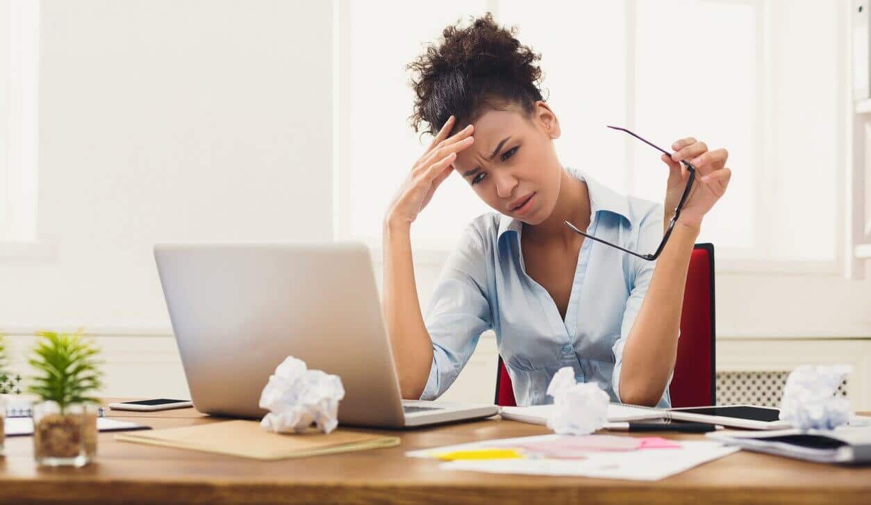 Woman stressed out at her desk
