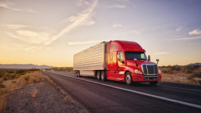 Trucking company fleet vehicle driving across the country