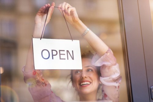 Small business owner opening up her business