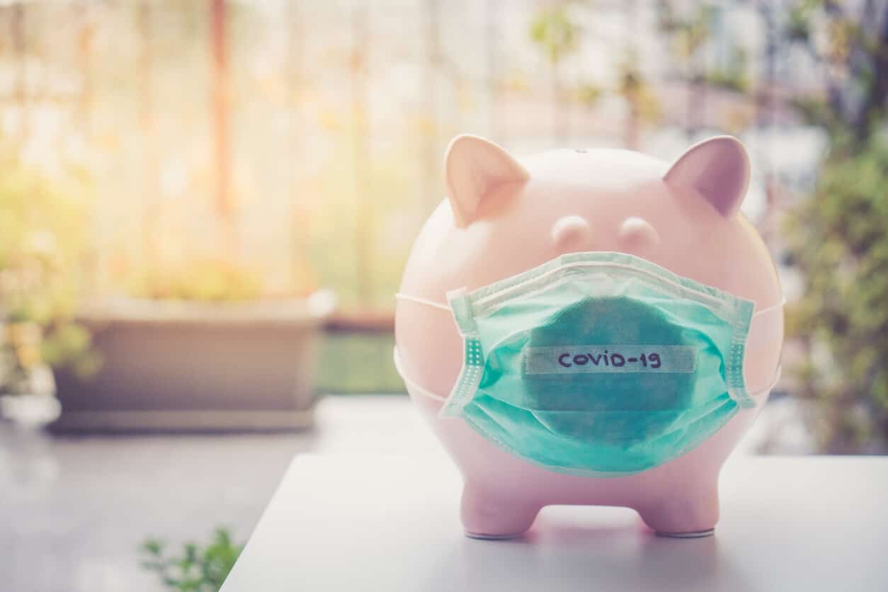 Piggy bank with Coronavirus face mask