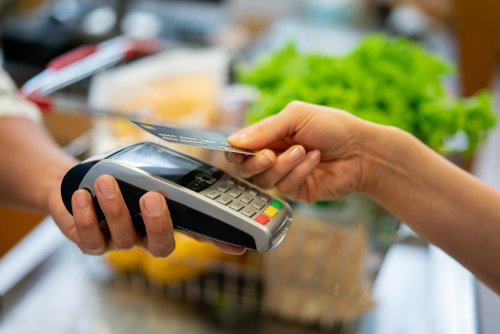 Person paying with a contactless credit card