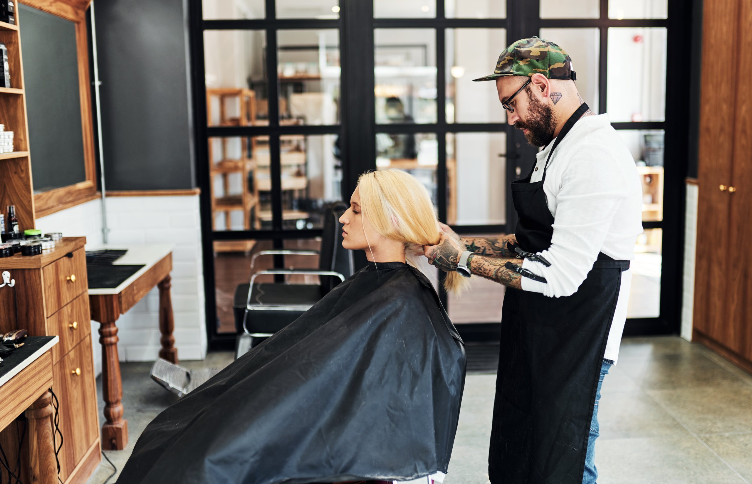 Salon business owner cutting hair