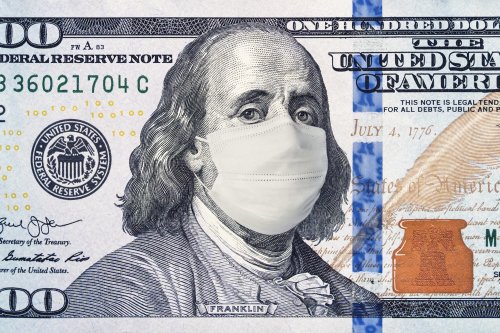 One hundred dollar bill with medical mask