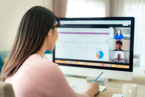 Female small business owner running a remote work meeting