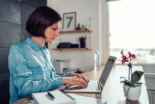 Female employee working from home on her laptop