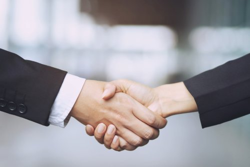 Business owners shaking hands