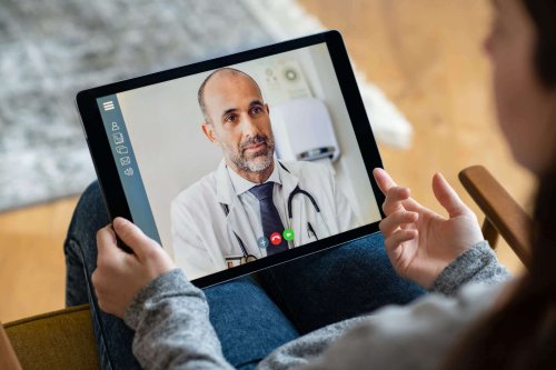 Woman talking with doctor virtually