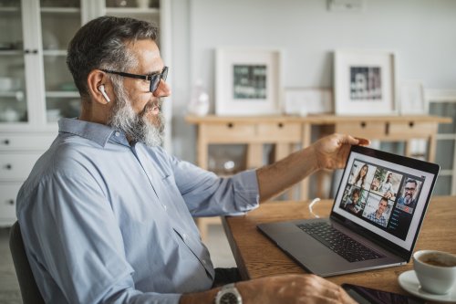 Male small business owner leading a virtual team meeting