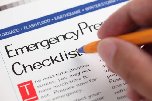 Person reviewing their emergency preparedness checklist