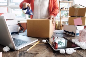 Woman packing product for her new small business