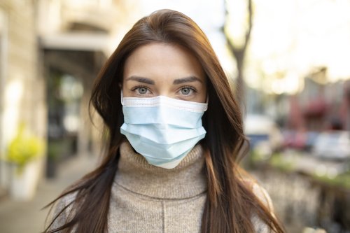 Young woman wearing a medical mask