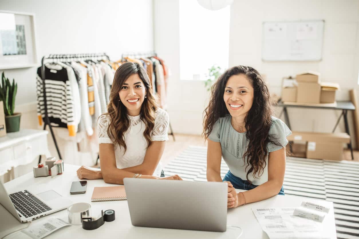 Two women working on their online store
