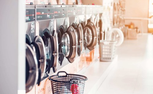 Open laundry machines at a laundromat