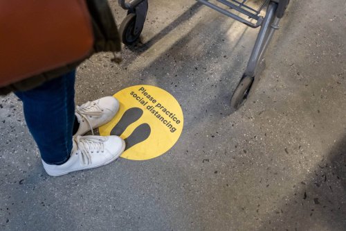 Social Distance Sign on the floor during COVID-19