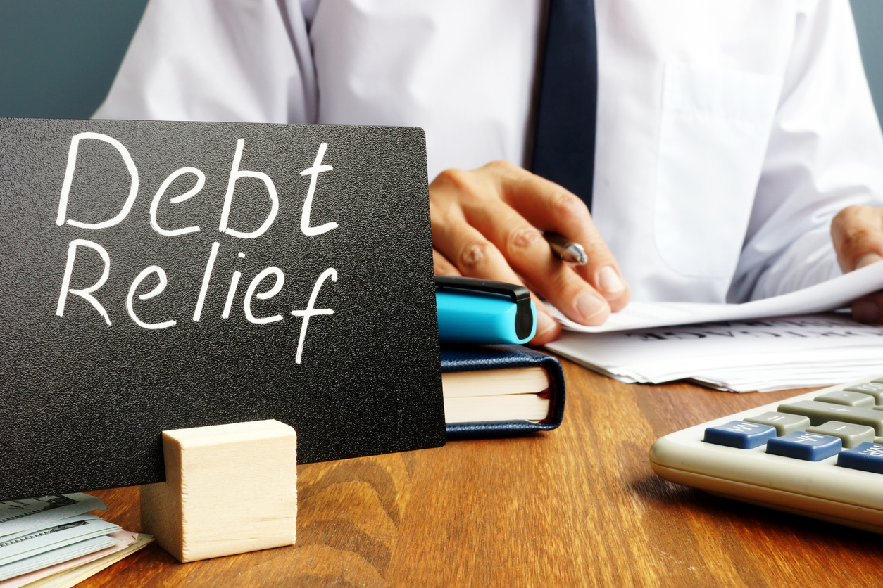Debt Relief Sign on Desk