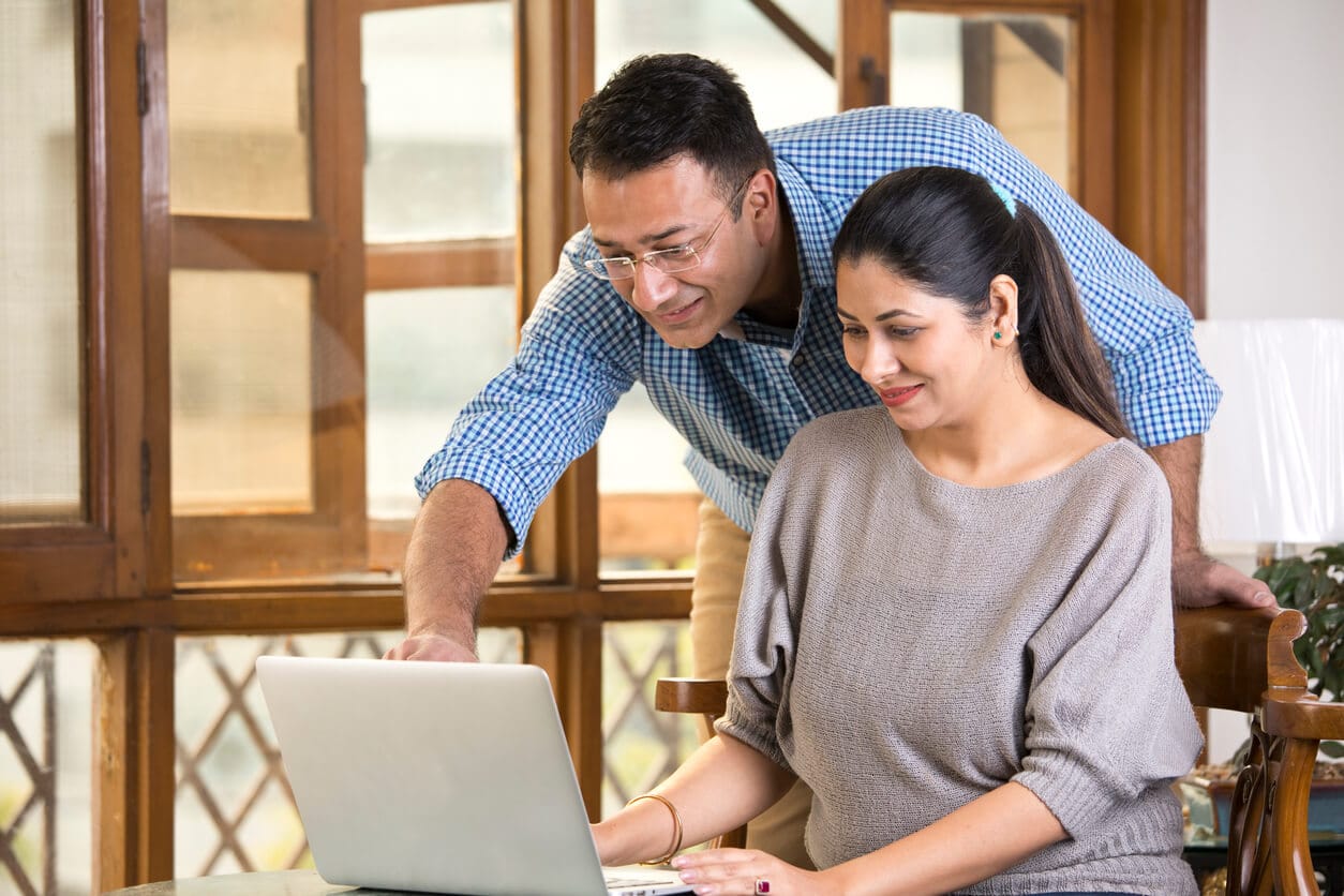 Couple reviewing business plan