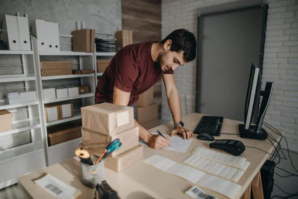 Man preparing packages for online business