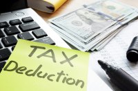 Tax Deduction Written on Memo on Desk