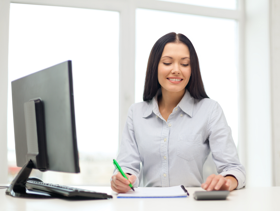 Woman doing bookkeeping via computer