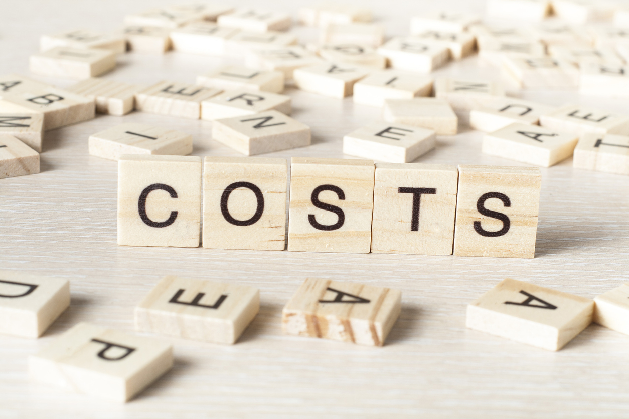 COSTS word concept on wood cubes.
