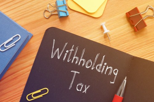 Withholding Tax written on notebook