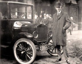 Henry Ford next to Model T