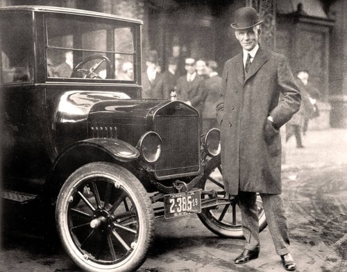 Henry Ford next to Model T