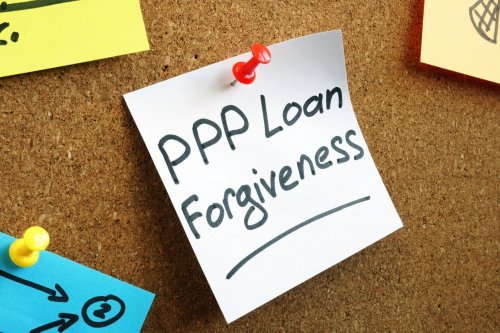 PPP loan forgiveness memo on a board