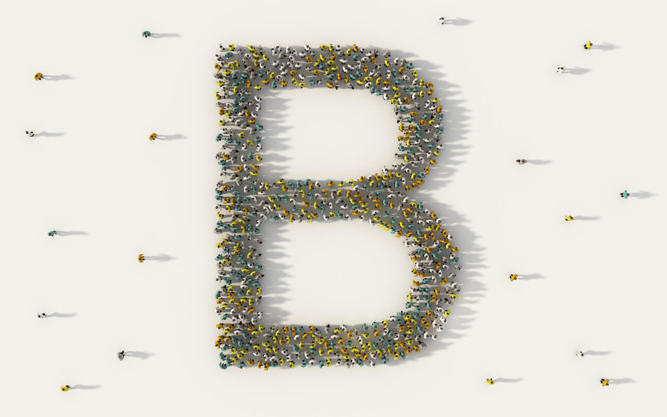 Group of people forming the letter b
