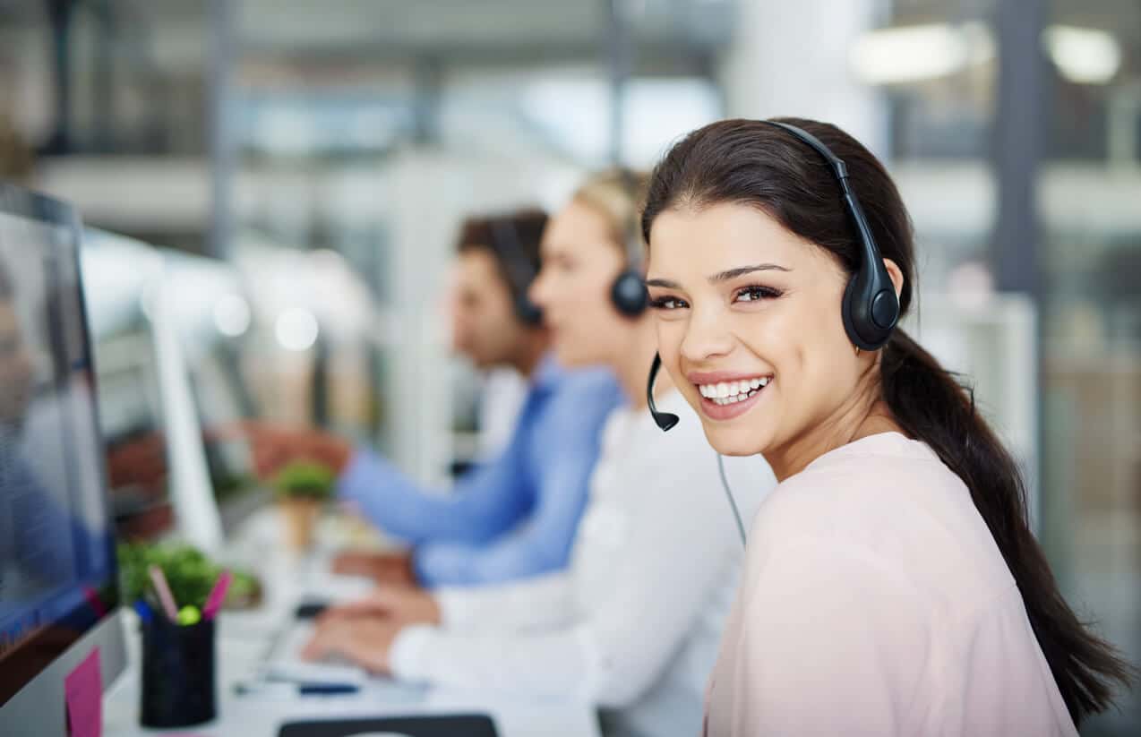 Young woman smiling and working in a call center