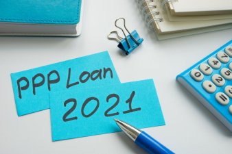 PPP loan 2021 words on the blue memo paper