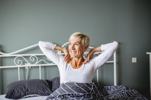 Woman waking up after healthy sleep